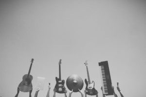 Instruments being held up in the air